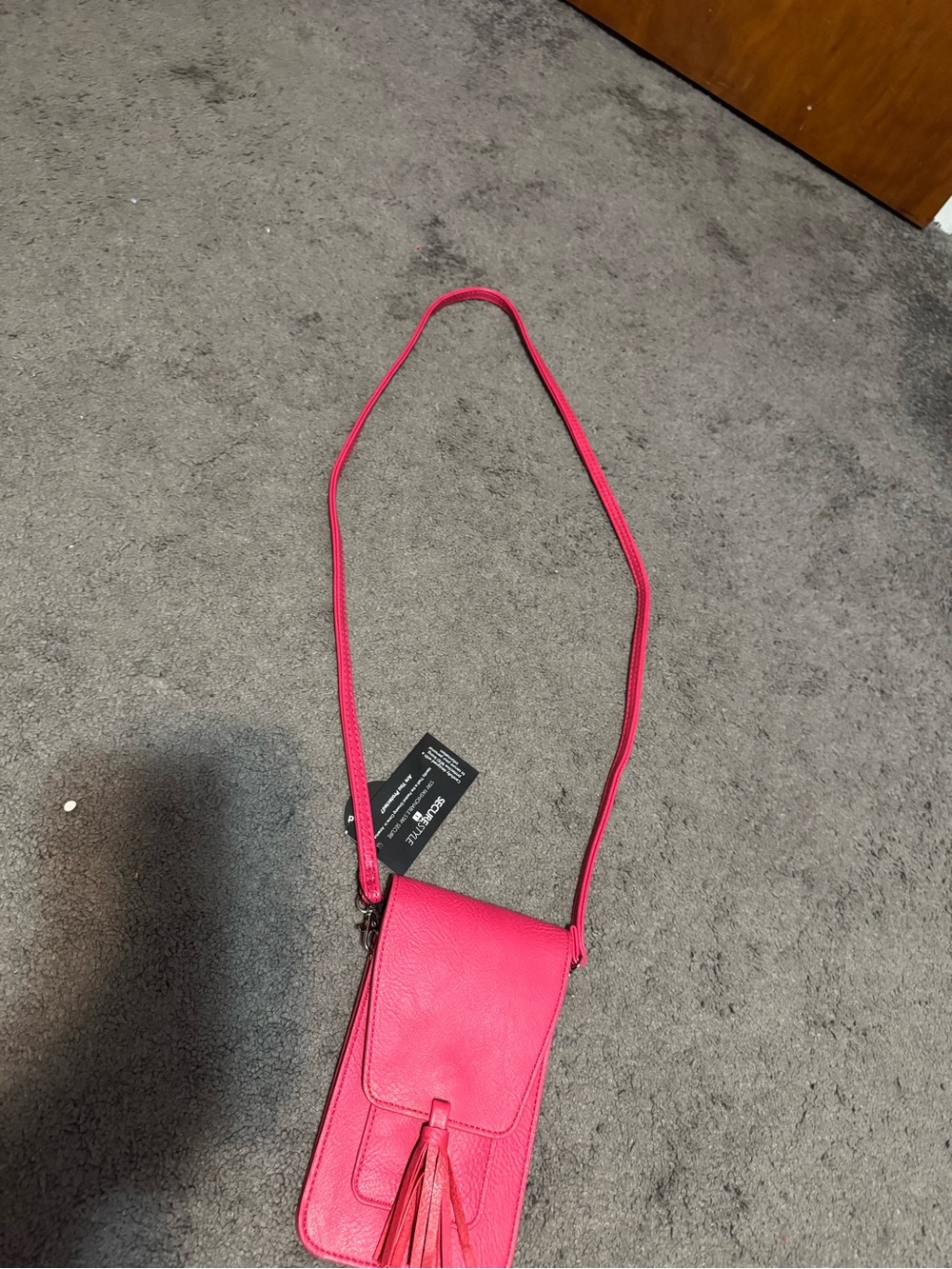 Compact Pink Crossbody Bag with Tassel Detail